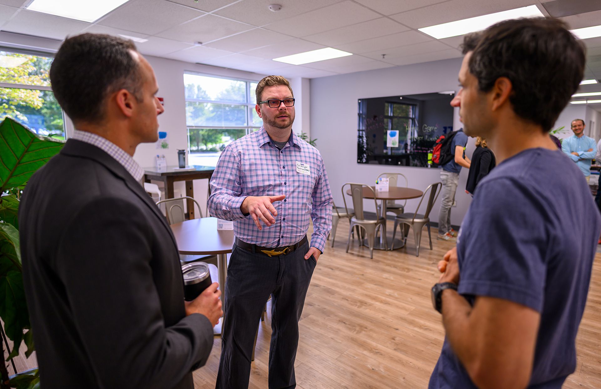 people talking in the cogro coworking space